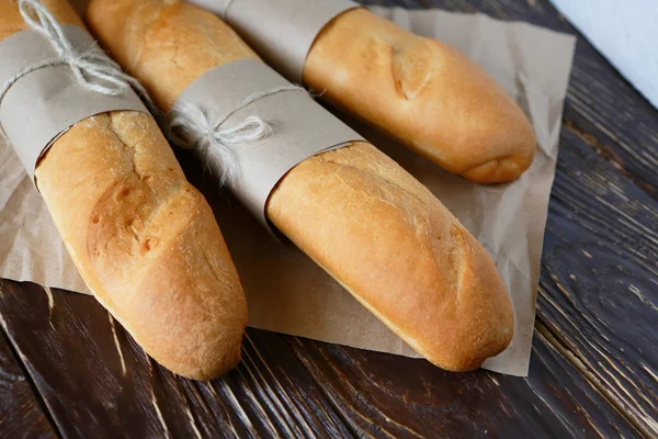 Baguettes on wrapping paper — Stock Photo, Image