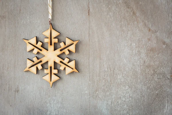 Old wooden background with snowflake — Stock Photo, Image