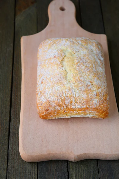 Whole ciabatta with cheese — Stock Photo, Image