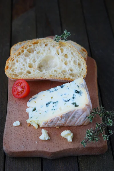 Piece of ciabatta with blue cheese — Stock Photo, Image