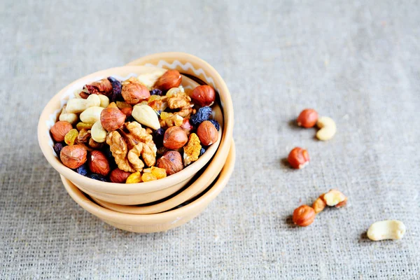 Mix nuts - walnuts, hazelnuts, almonds, raisins — Stock Photo, Image