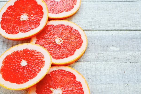 Ripe grapefruit on white boards — Stock Photo, Image