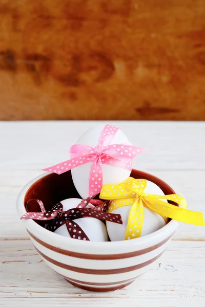 Easter eggs decorated with ribbons — Stock Photo, Image