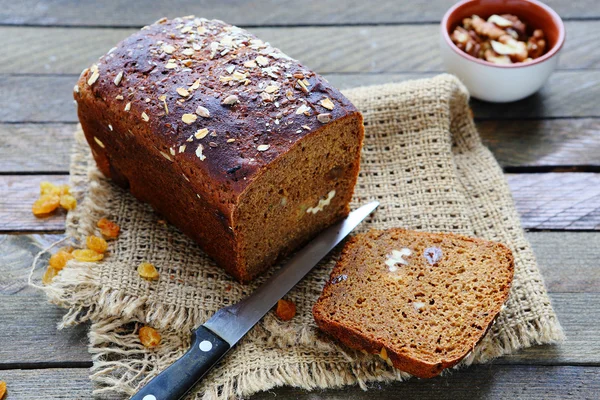 Loaf of rye bread with nuts and raisins — Stock Photo, Image