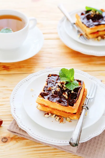 Waffles with chocolate and tea — Stock Photo, Image