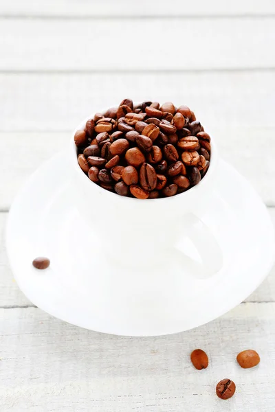 Coffee beans in a white cup — Stock Photo, Image