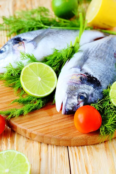Raw fish and ingredients, cooking — Stock Photo, Image