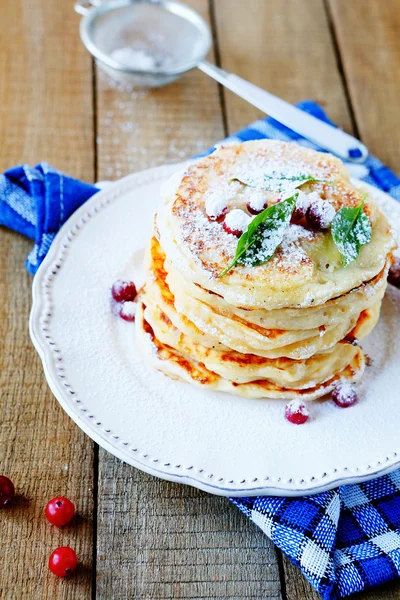 Stack of pancakes with sweet cranberries — Stock Photo, Image