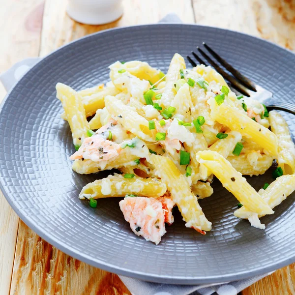 Penne with slices of red fish — Stock Photo, Image