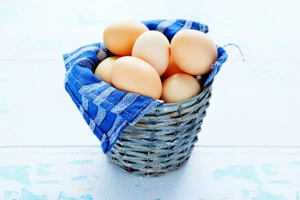 Fresh chicken eggs in an old bucket — Stock Photo, Image