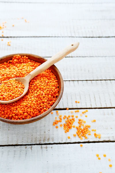 Uncooked red lentils in a bowl — Stok fotoğraf