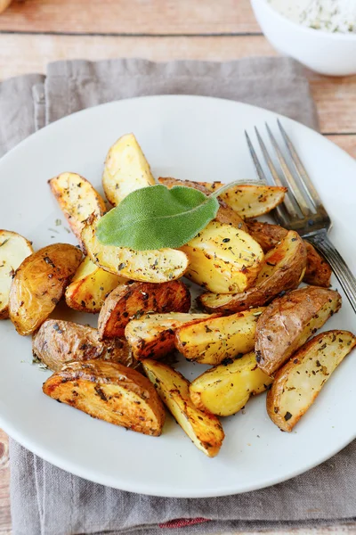 Potato wedges with skin baked in the oven — Stock Photo, Image