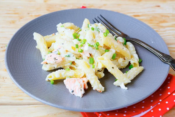 Tasty pasta with salmon and cheese — Stock Photo, Image