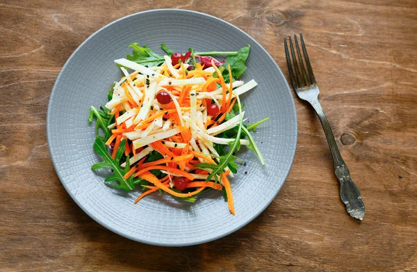Carrot - celery salad with cranberries — Stock Photo, Image
