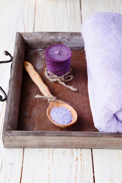 Sea salt, candle, towel on tray — Stock Photo, Image