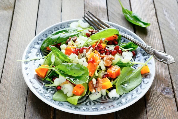 Salad with celery and pumpkin, spinach — Stock Photo, Image