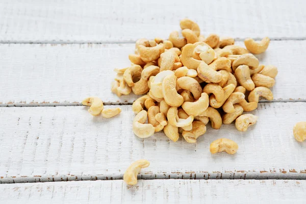 Cashew left on white boards — стоковое фото