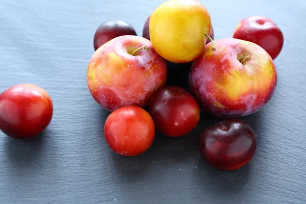 Fresh fruit on slate background — Stock Photo, Image