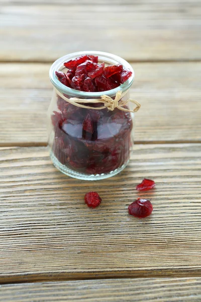 Dried cranberries in a glass jar — Stock Photo, Image