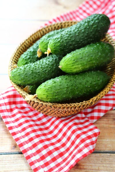 Fresh crunchy cucumbers in a basket — Stock Photo, Image