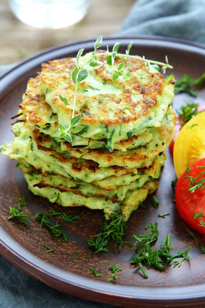 Pancakes with zucchini and herbs — Stock Photo, Image