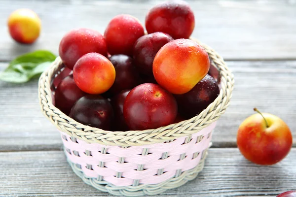 Juicy fruit in a wicker basket — Stock Photo, Image