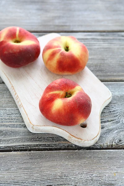 Flat peach on a white board — Stock Photo, Image