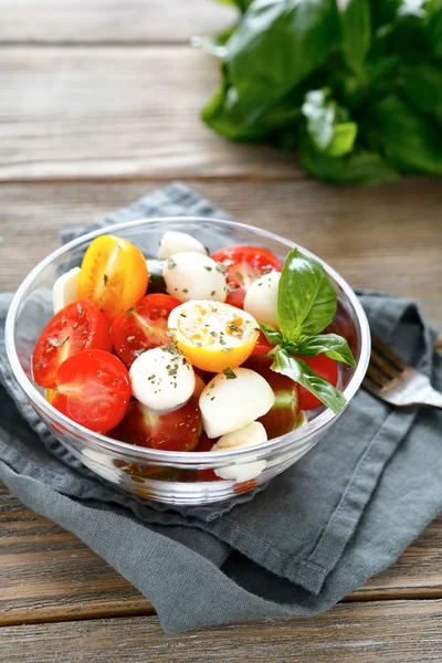 Caprese salad in a transparent bowl — Stock Photo, Image