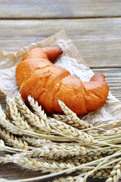 Croissant and wheat — Stock Photo, Image