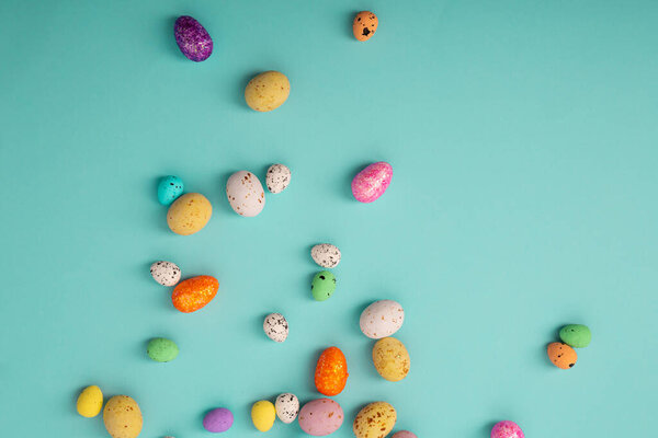 Easter color background with eggs candy and decor