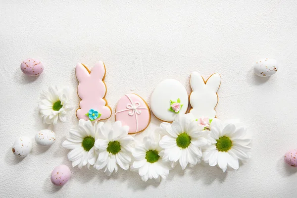 Overhead View Easter Bunny Eggs Cookies White Flowers Light Surface — Stock Photo, Image