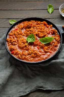 Top view of bolognese sauce in pan comfort food making pasta beef ragu