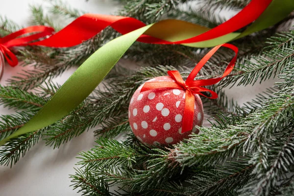Close Christmas Polka Dots Red Ball Green Branches Holiday Concept — Stock Photo, Image