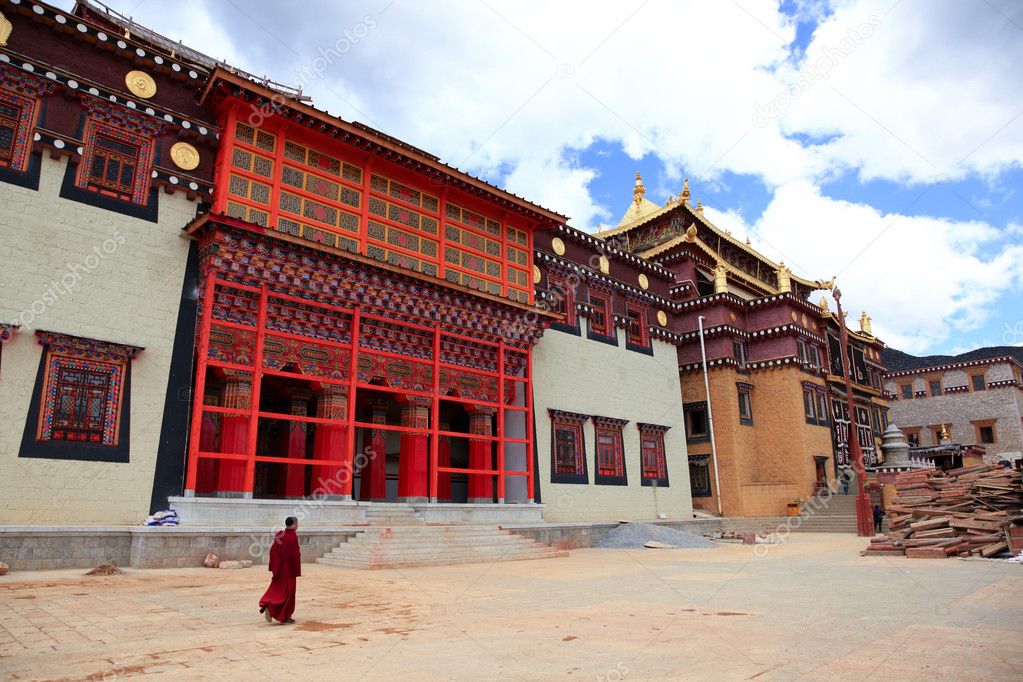 Tibetan monk is walking in Songzanlin Monastery in Zhongdian (Sh
