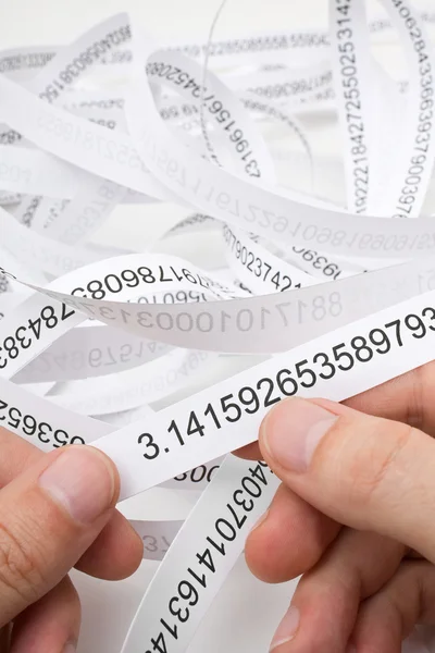 Researcher holding start of printout of the number — Stock Photo, Image