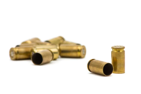 Empty, Fired, Blood Covered 9mm Bullet Casings On Wooden Floor