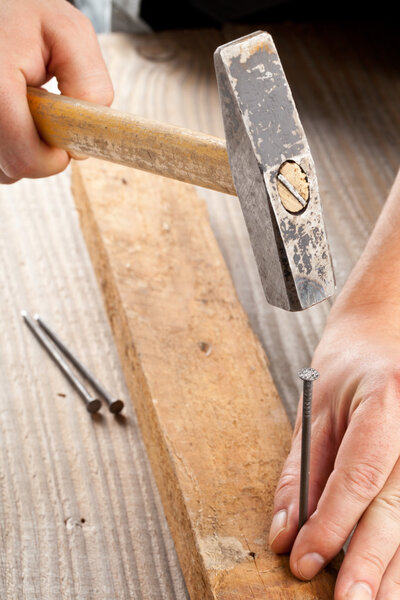 Hammer and nail woodworking