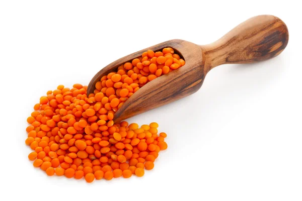 Red lentils on scoop — Stock Photo, Image