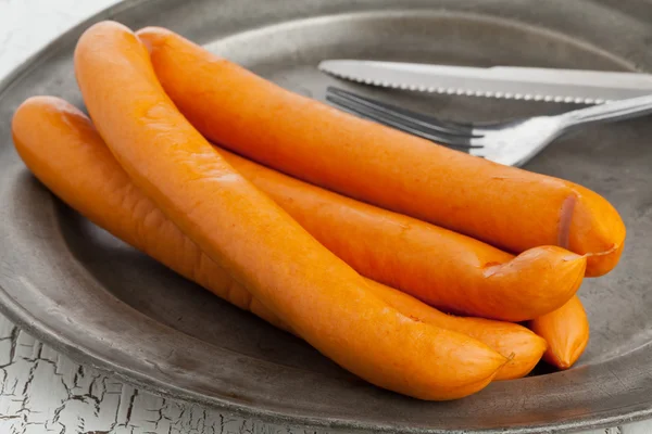 Vienna sausages on old plate — Stock Photo, Image