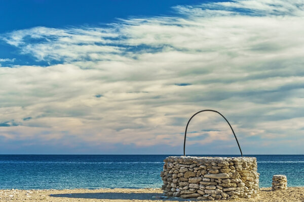 Stone well at beach