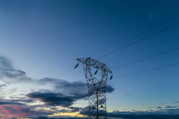 Hig voltage at sunset — Stock Photo, Image