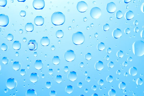 Achtergrond van gekleurde waterdruppels — Stockfoto
