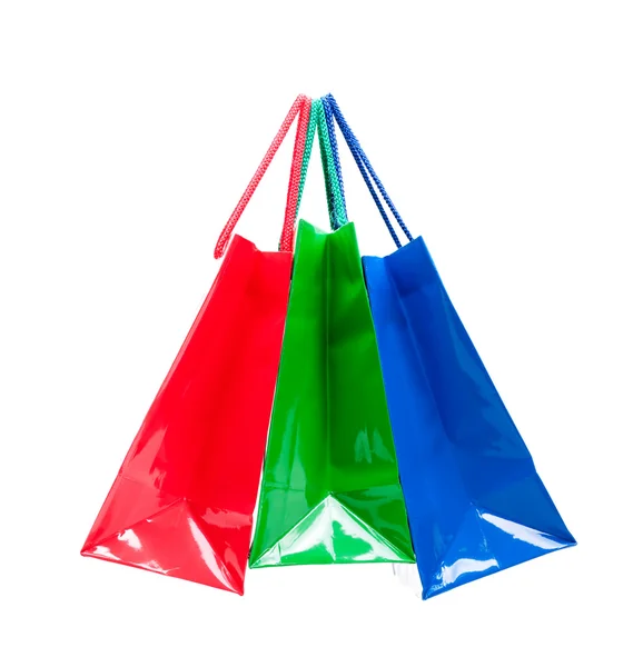 Tři barevné lesklé dárkové tašky zavěšené dohromady — Stock fotografie