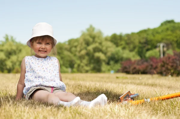 Little adorable girl in the park — Stock Photo, Image