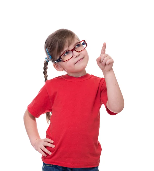Маленькая девочка в очках и указывает указательным пальцем на кого-то Стоковое Изображение