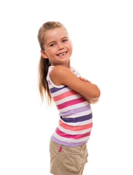 Malá dívka stojící na bílém pozadí — Stock fotografie