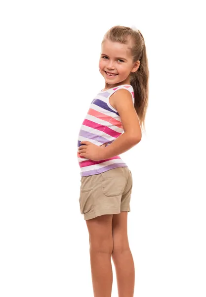 Μικρό κορίτσι γύρισε στην άκρη να στέκεται πάνω σε λευκό φόντο — Φωτογραφία Αρχείου