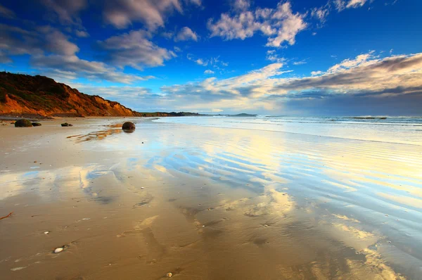 Plaja Koekohi, Bolovani Moeraki, Noua Zeelandă Fotografie de stoc