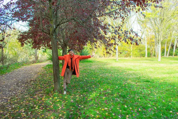 Woman Orange Coat Open Arms Tree — Stock Photo, Image