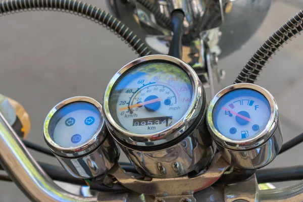 a vintage motorcycle chrome plated dashboard